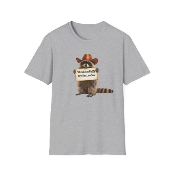 16847914750392225950_2048.jpeg Raccoon Rodeo T‑Shirt — "This actually IS my first rodeo" Cute Western Graphic Tee