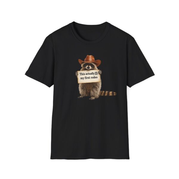 1878053346071028701_2048.jpeg Raccoon Rodeo T‑Shirt — "This actually IS my first rodeo" Cute Western Graphic Tee